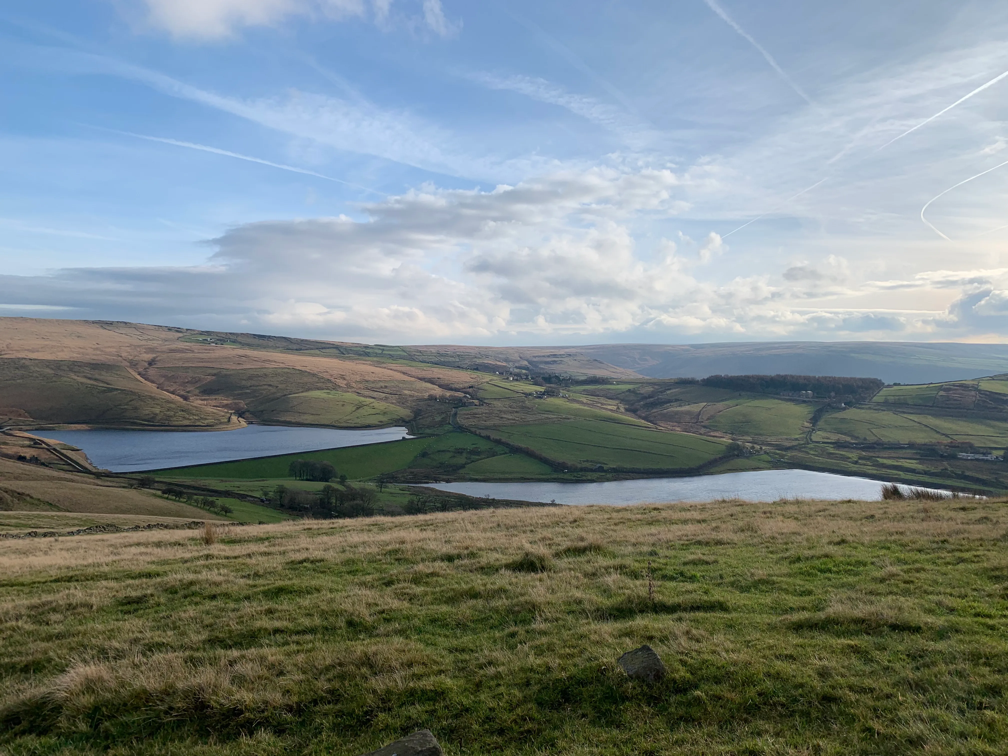 A panoramic view of the Castleshaw valley, taken from the surrounding hills, looking at the 2 resovoirs and the Roman fort.